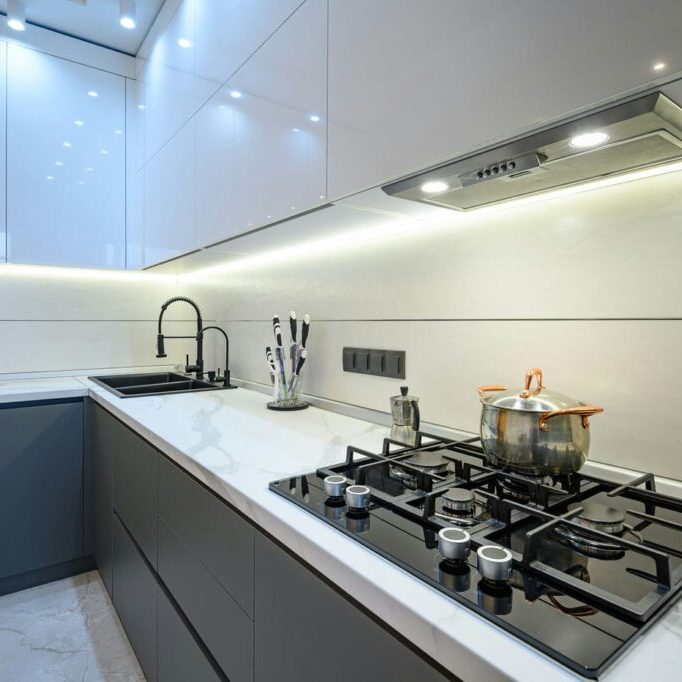 basement kitchen renovation with modern lighting