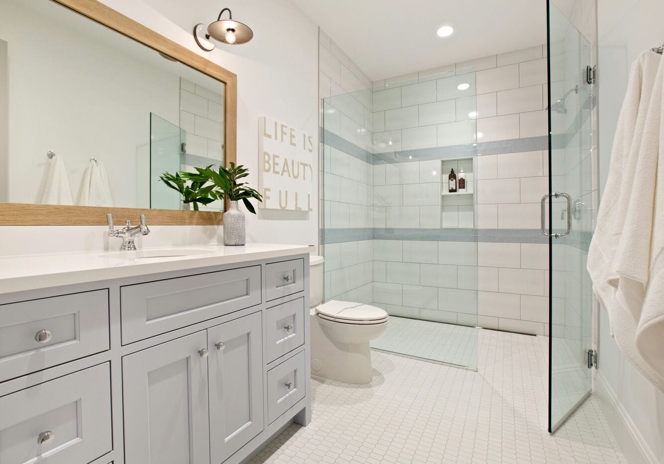 bathroom renovation with frameless shower glass