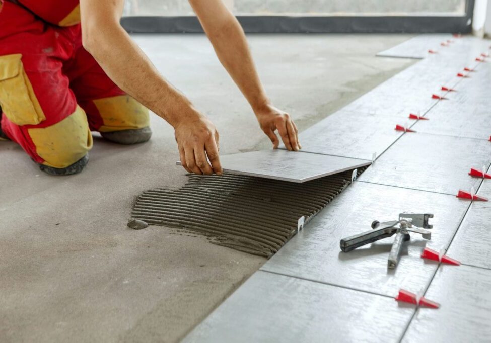 contractor installing new tiles